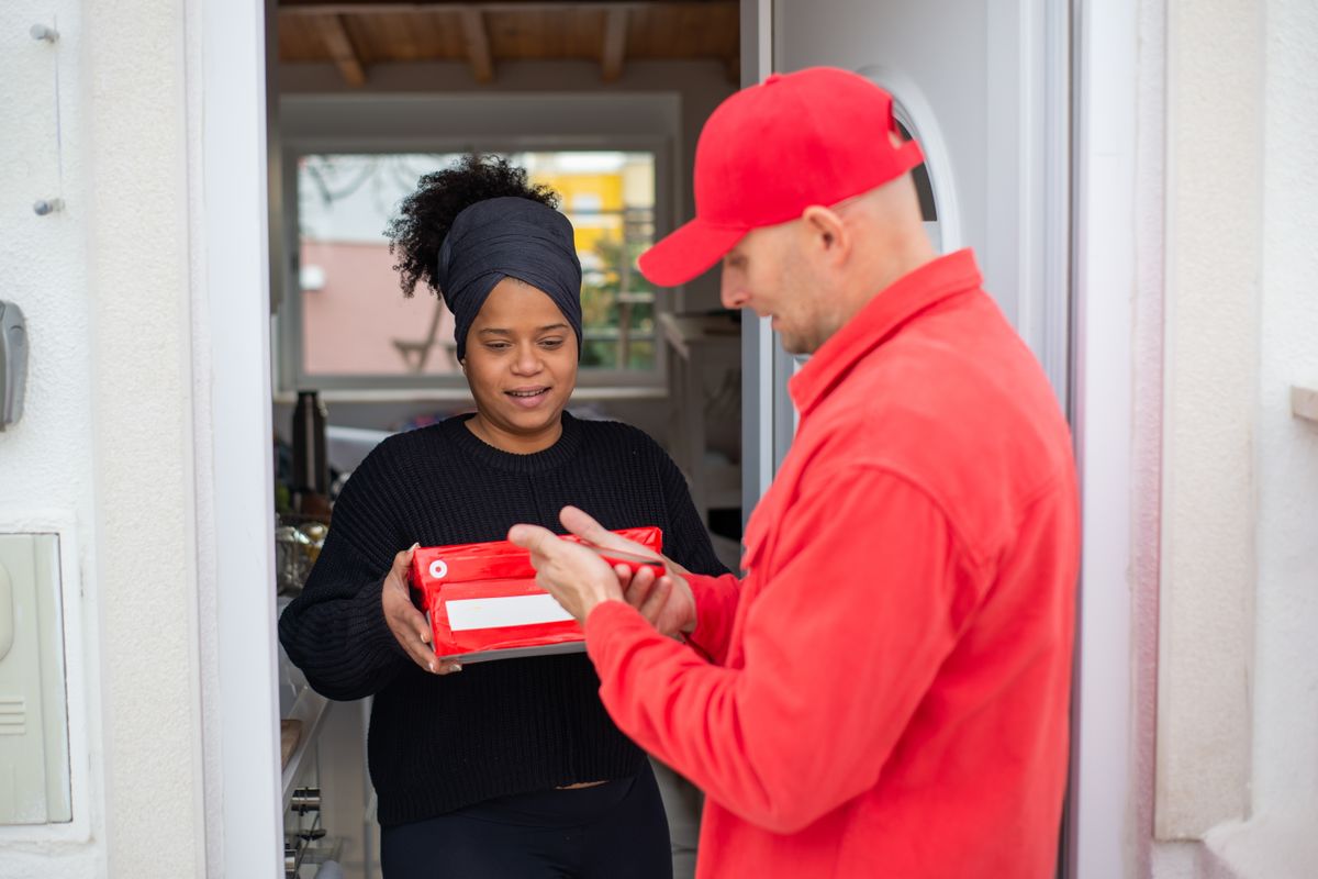 Service pro greeting a customer at the door