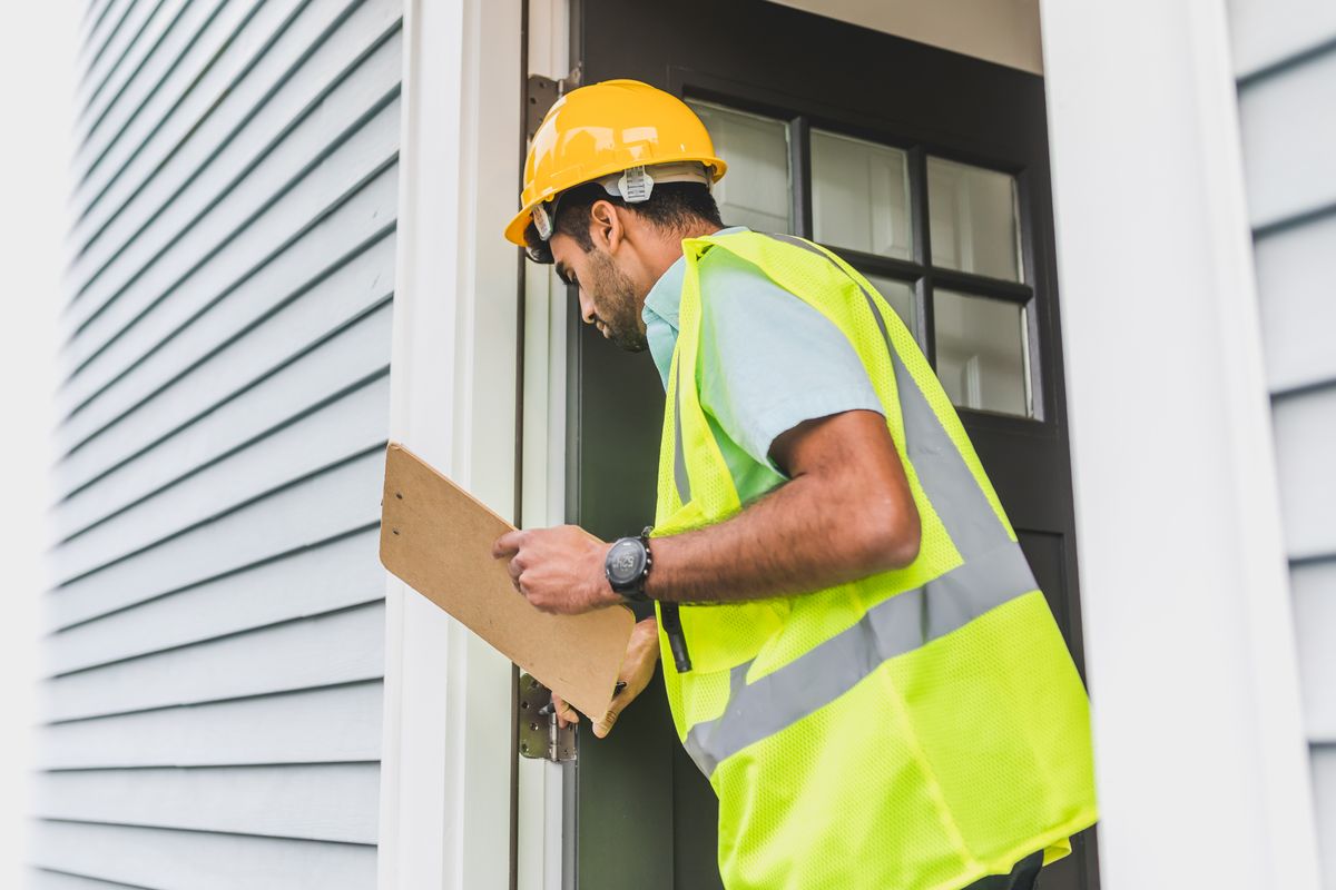 Contractor writing an estimate