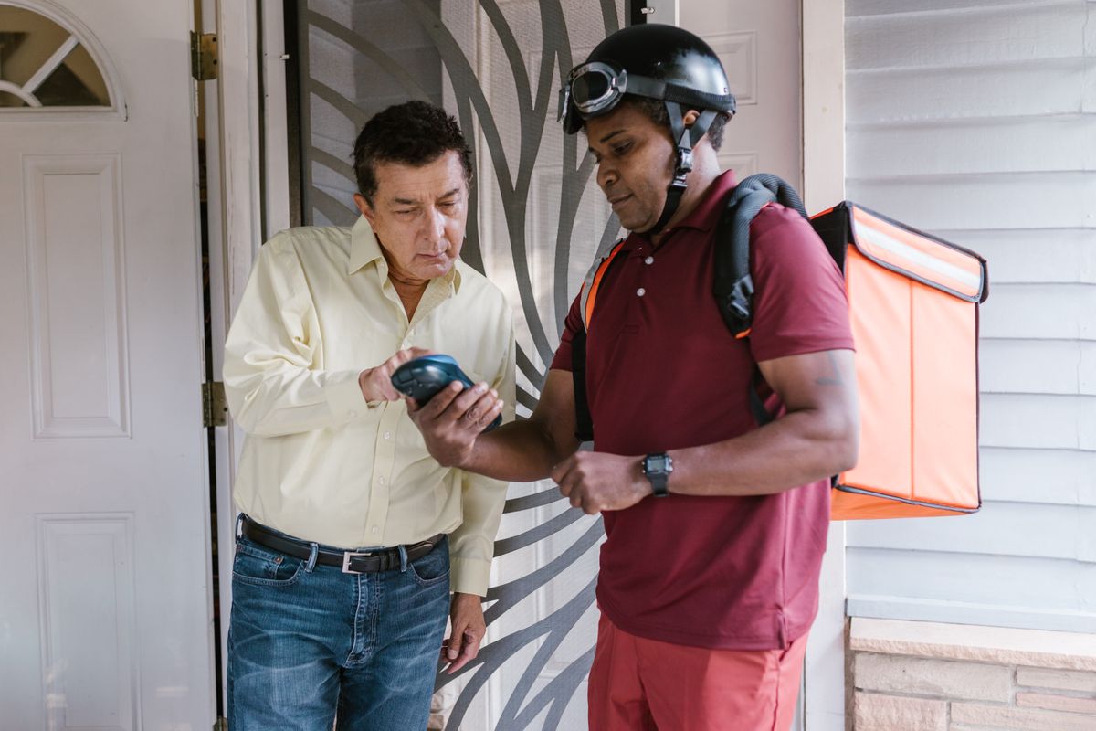 Repair technician arriving at an apartment door